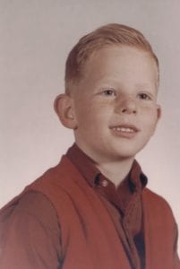 Scott Gordon as a red-haired boy